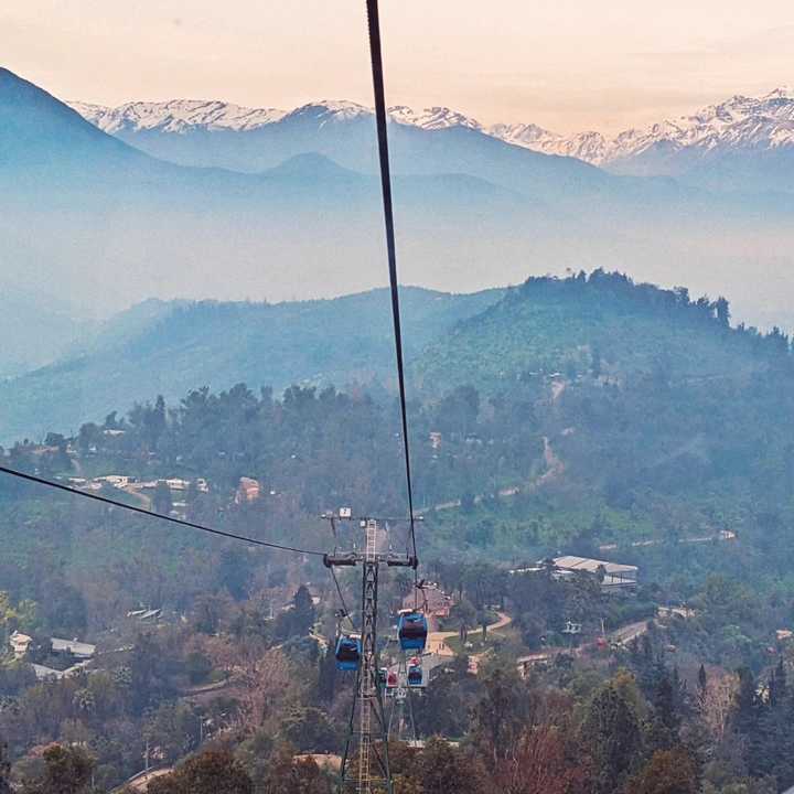 Santiago cable car, with mountains in the background.