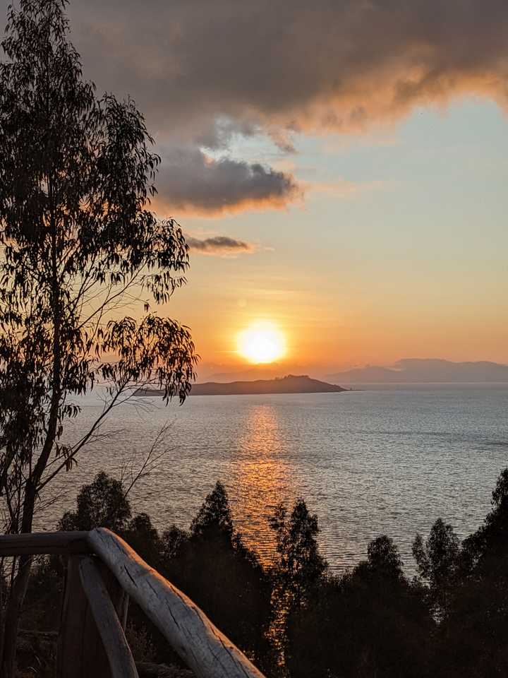 Sunrise over an island in a lake