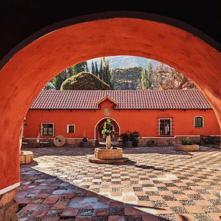 Painted red walls and tiled floor of a historical hacienda