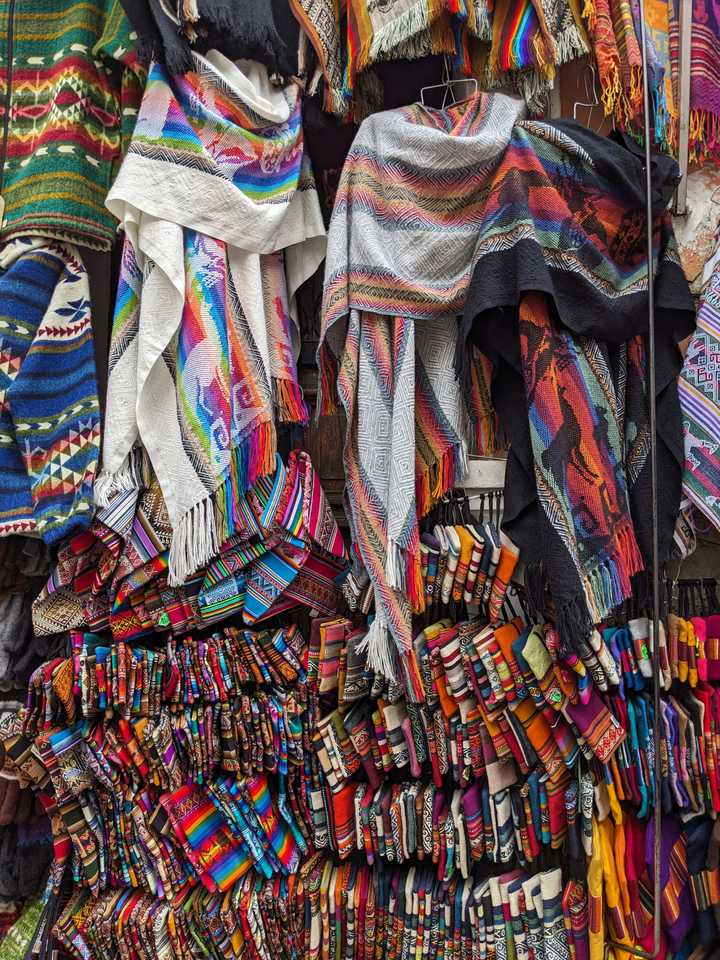 Multicoloured fabrics hanging on display